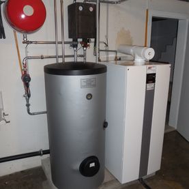 Installation d'une chaudière à mazout à condensation avec production d'eau chaude - Oggier chauffage sanitaire
